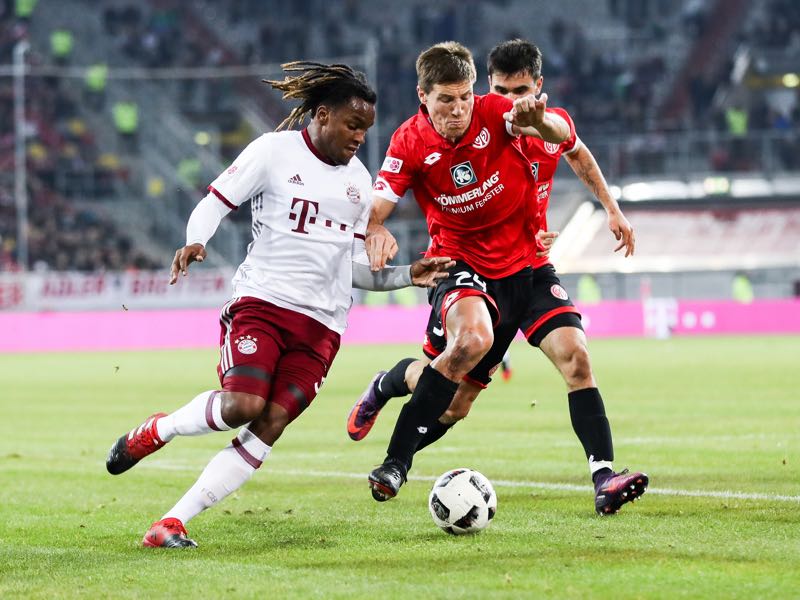 Renato Junior Luz Sanches of Bayern (L) and Gaetan Bussmann of Mainz (C) fight for the ball during Final Match between Bayern and 1. FSV Mainz 05 during Telekom Cup 2017 a at Esprit-Arena on January 14, 2017 in Duesseldorf, Germany. (Photo by Maja Hitij/Bongarts/Getty Images)