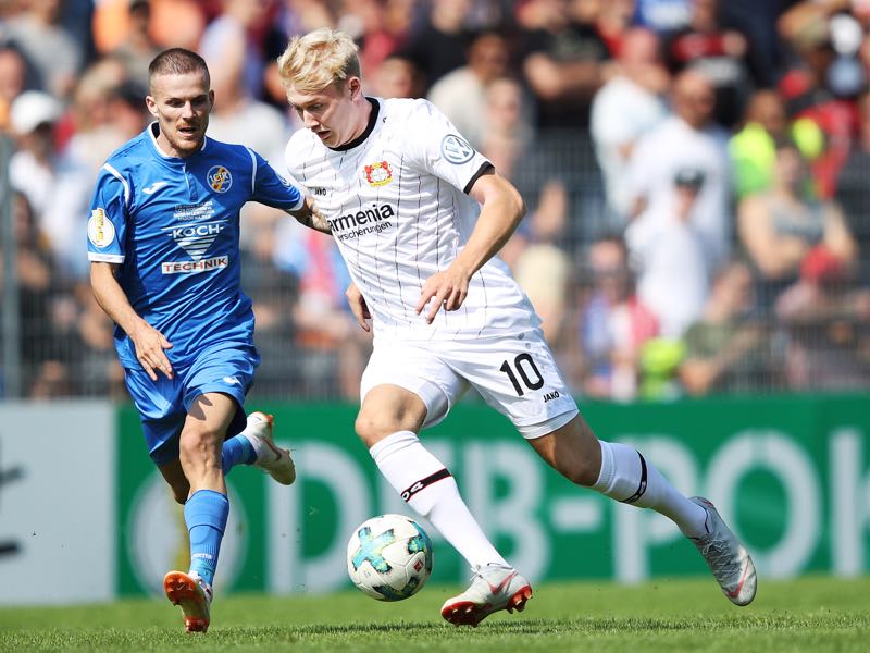 Julian Brandt of Bayer Leverkusen is tackled by Kreshnik Lushtaku of 1. CfR Pforzheim during the DFB Cup match between 1. CfR Pforzheim and Bayer Leverkusen on August 18, 2018 in Pforzheim, Germany. (Photo by Adam Pretty/Bongarts/Getty Images)