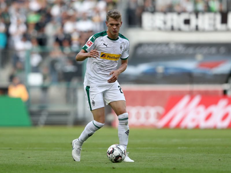 Matthias Ginter of Moenchengladbach runs with the ball during the Bundesliga match between Borussia Moenchengladbach and Bayer 04 Leverkusen at Borussia-Park on August 25, 2018 in Moenchengladbach, Germany. The match between Gladbach and Leverkusen ended 2-0. (Photo by Christof Koepsel/Bongarts/Getty Images)