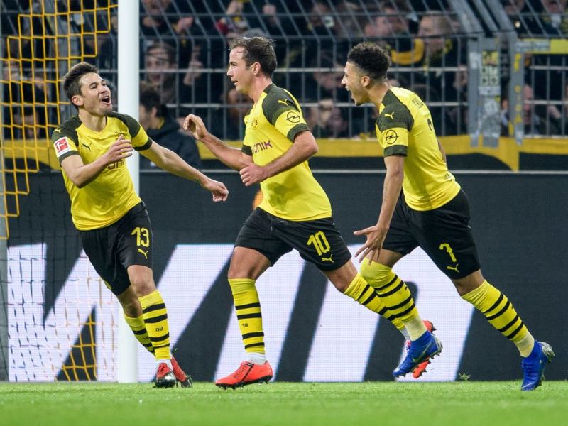 Dortmund v Hannover (L-R) Raphael Guerreiro, Mario Goetze and Jadon Sancho of Dortmund celebrate after the 3-0 lead during the Bundesliga match between Borussia Dortmund and Hannover 96 at the Signal Iduna Park on January 26, 2019 in Dortmund, Germany. (Photo by Jörg Schüler/Getty Images)