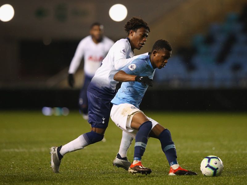  Rabbi Matondo of Manchester City holds off a challenge from Tariq Hinds of Tottenham Hotspur during the Premier League 2 match between Manchester City and Tottenham Hotspur at The Academy Stadium on December 15, 2018 in Manchester, England. (Photo by Alex Livesey/Getty Images)