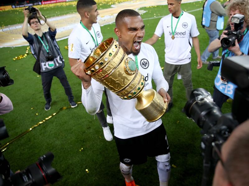  Kevin Prince Boateng celebrates with the DFB Cup trophy after winning the DFB Cup final against Bayern Muenchen at Olympiastadion on May 19, 2018 in Berlin, Germany. (Photo by Lars Baron/Bongarts/Getty Images)