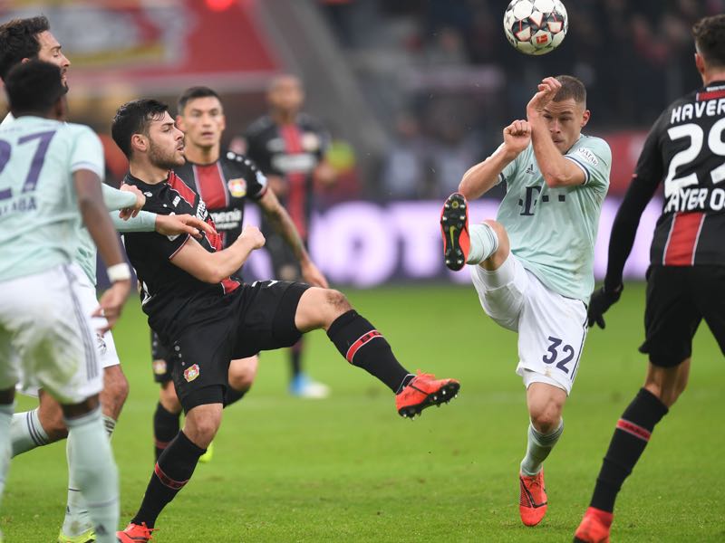 Leverkusen v Bayern - Leverkusen's German forward Kevin Volland and Bayern Munich's German midfielder Joshua Kimmich vie for the ball during the German first division Bundesliga football match Bayer Leverkusen vs Bayern Munich in Leverkusen, western Germany, on February 2, 2019. (Photo by Patrik STOLLARZ / AFP) 