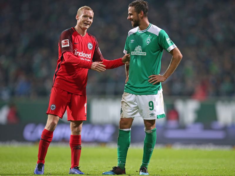 Sebastian Rode of Eintracht Frankfurt and Martin Harnik of Werder Bremen talk to each other during the Bundesliga match between SV Werder Bremen and Eintracht Frankfurt at Weserstadion on January 26, 2019 in Bremen, Germany. (Photo by Cathrin Mueller/Bongarts/Getty Images)