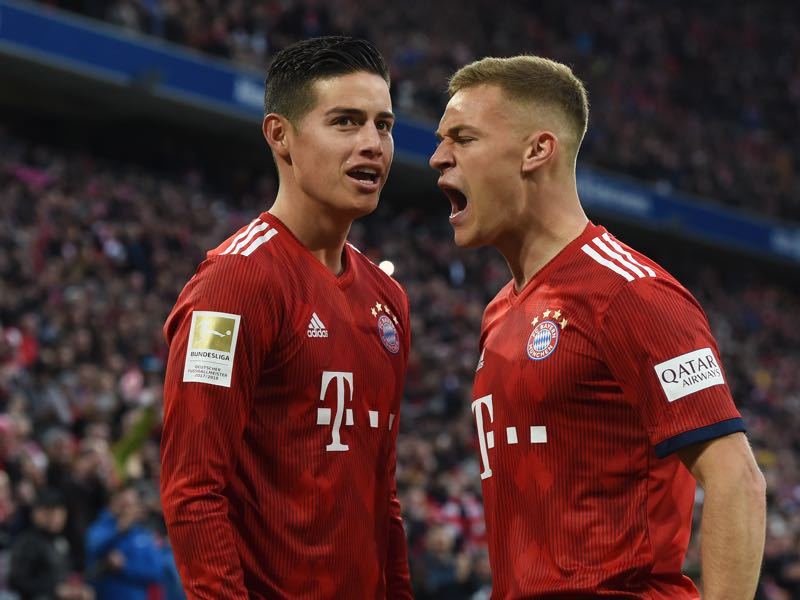 Bayern v Wolfsburg - Bayern Munich's midfielder Joshua Kimmich (R) and Bayern Munich's Colombian James Rodriguez (L) react after their third goal during the German first division Bundesliga football match Bayern Munich vs VfL Wolfsburg on March 9, 2019 in Munich. (Photo by Christof STACHE / AFP) 