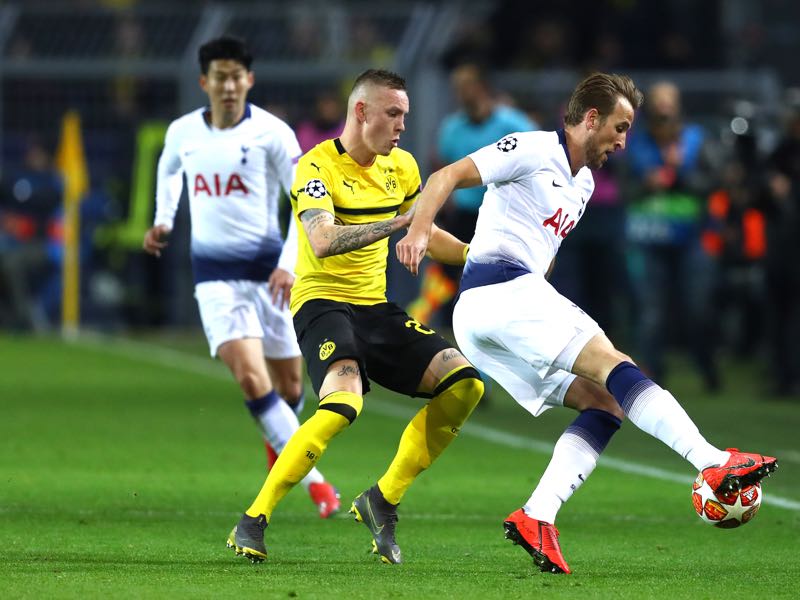 Dortmund v Tottenham - Marius Wolf of Borussia Dortmund tackles Harry Kane of Tottenham Hotspur during the UEFA Champions League Round of 16 Second Leg match between Borussia Dortmund and Tottenham Hotspur at Westfalen Stadium on March 05, 2019 in Dortmund, North Rhine-Westphalia. (Photo by Maja Hitij/Bongarts/Getty Images)