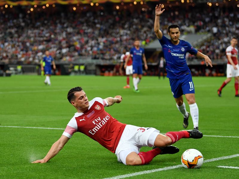 Granit Xhaka of Arsenal attempts to keep the ball in play during the UEFA Europa League Final between Chelsea and Arsenal at Baku Olimpiya Stadionu on May 29, 2019 in Baku, Azerbaijan. (Photo by Dan Mullan/Getty Images)