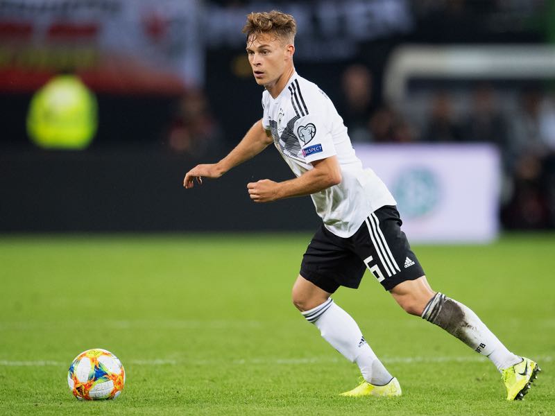 Joshua Kimmich of Germany controls the ball during the UEFA Euro 2020 qualifier match between Germany and Netherlands at Volksparkstadion on September 06, 2019 in Hamburg, Germany. (Photo by Matthias Hangst/Bongarts/Getty Images)