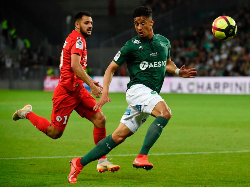 Montpellier's French forward Gaitan Laborde (L) vies with Saint-Etienne's French defender William Saliba (R) during the French L1 football match between Saint-Etienne (ASSE) and Montpellier (MHSC) on May 10, 2019, at the Geoffroy Guichard Stadium in Saint-Etienne, central France. (Photo by JEAN-PHILIPPE KSIAZEK / AFP)