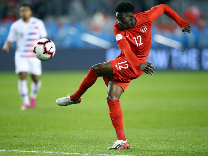 Canada v USA - Alphonso Davies #12 of Canada has a shot on goal during a CONCACAF Nations League game against the United States at BMO Field on October 15, 2019 in Toronto, Canada. (Photo by Vaughn Ridley/Getty Images)