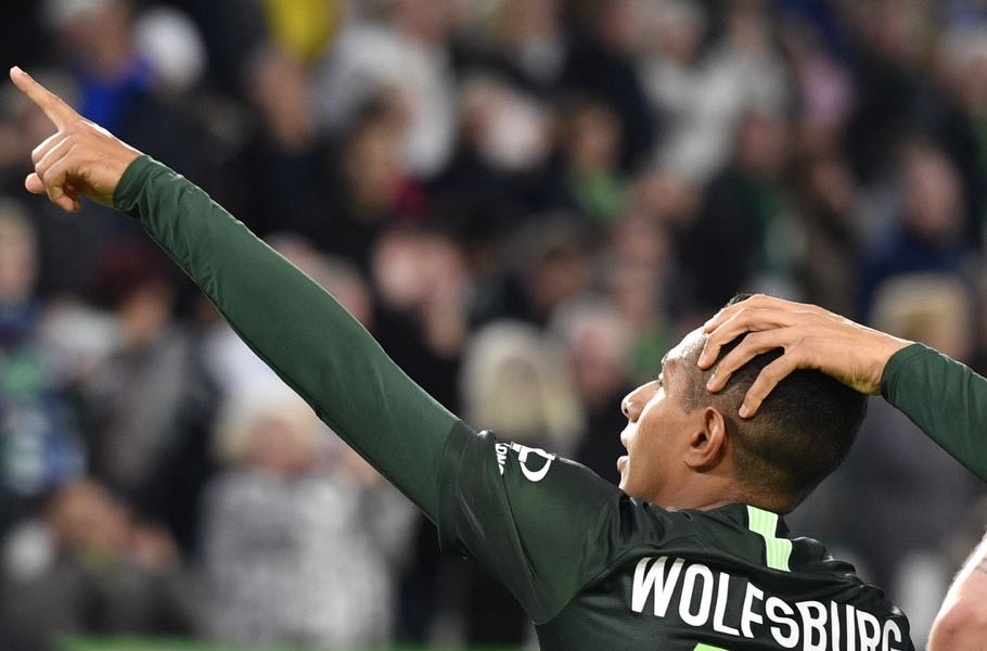 Wolfsburg's Brazilian forward Joao Victor (C) celebrates his goal, that was later disallowed, during the German First division Bundesliga football match between VfL Wolfsburg and FC Augsburg, on October 27, 2019 in Wolfsburg. - The goal was later disallowed. (Photo by John MACDOUGALL / AFP)